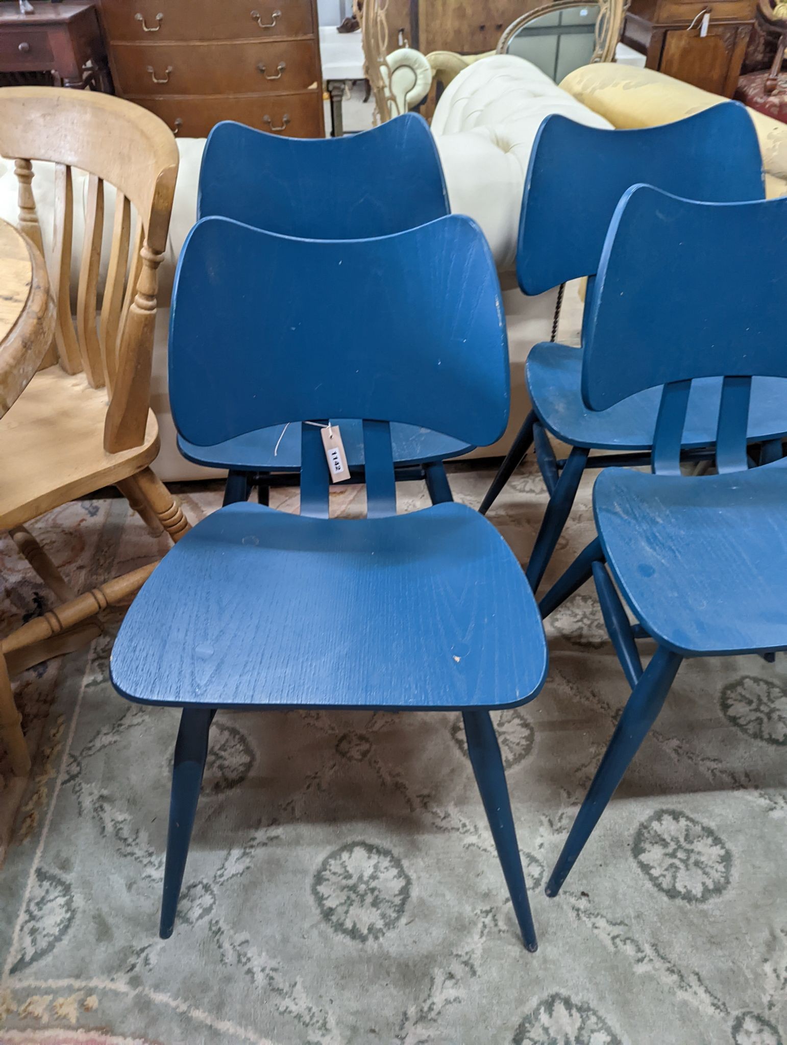 A set of four Ercol butterfly chairs